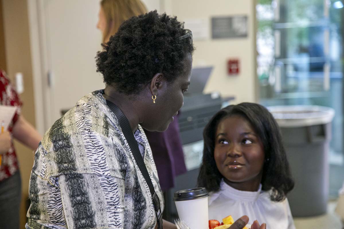 Students celebrate making deans list at event.