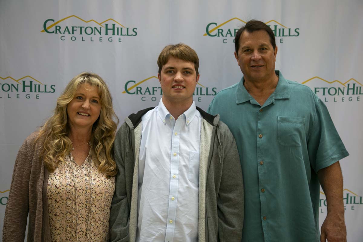 Students celebrate making deans list at event.