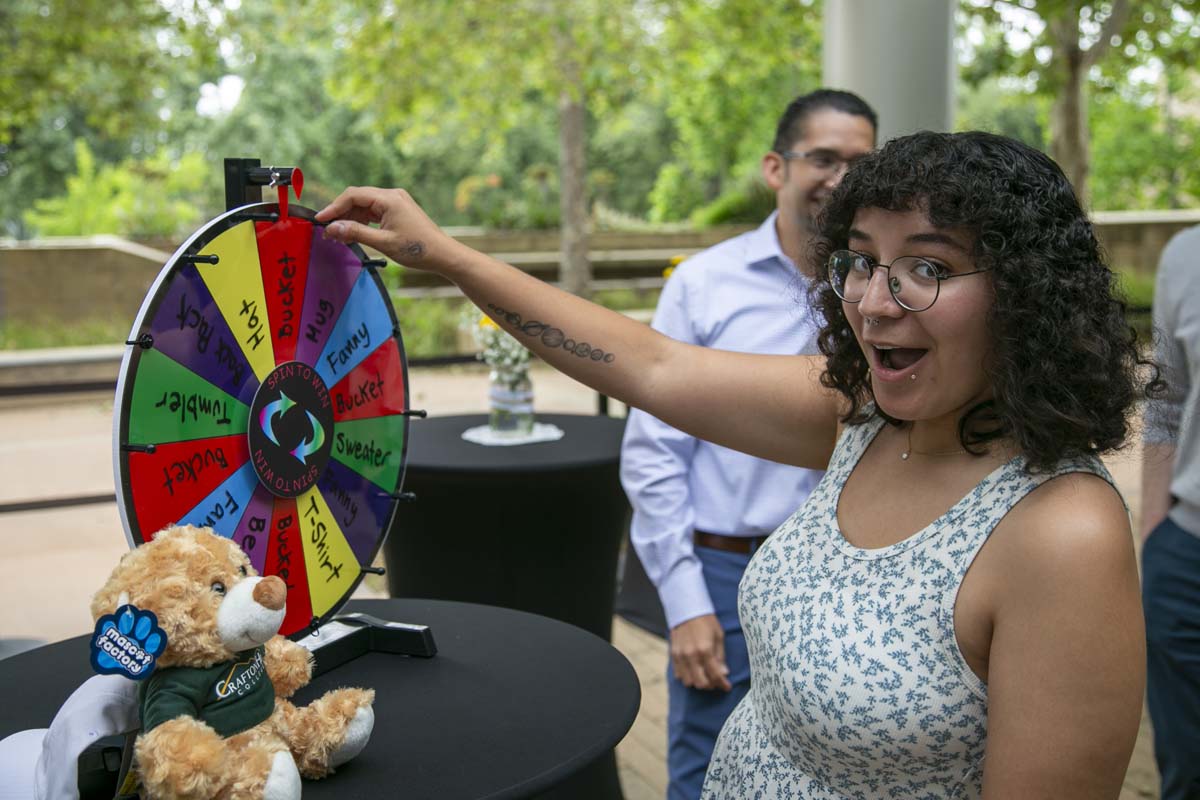 Students celebrate making deans list at event.