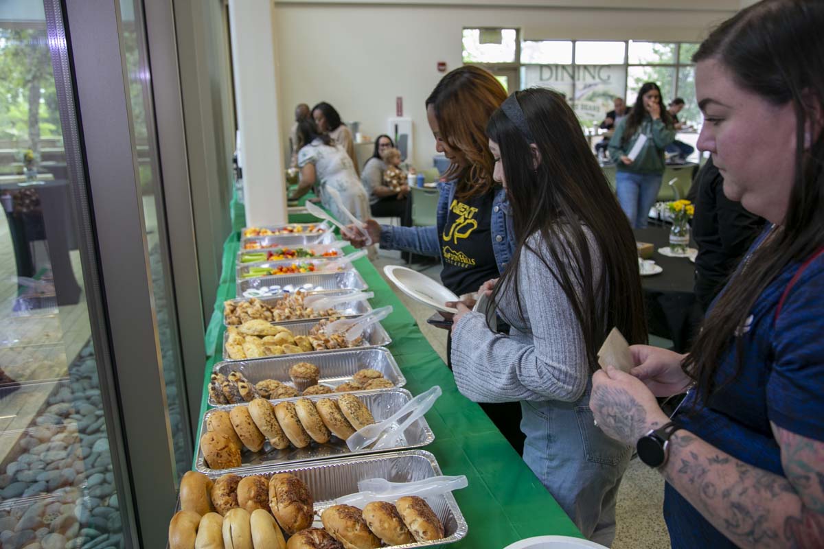 Students celebrate making deans list at event.