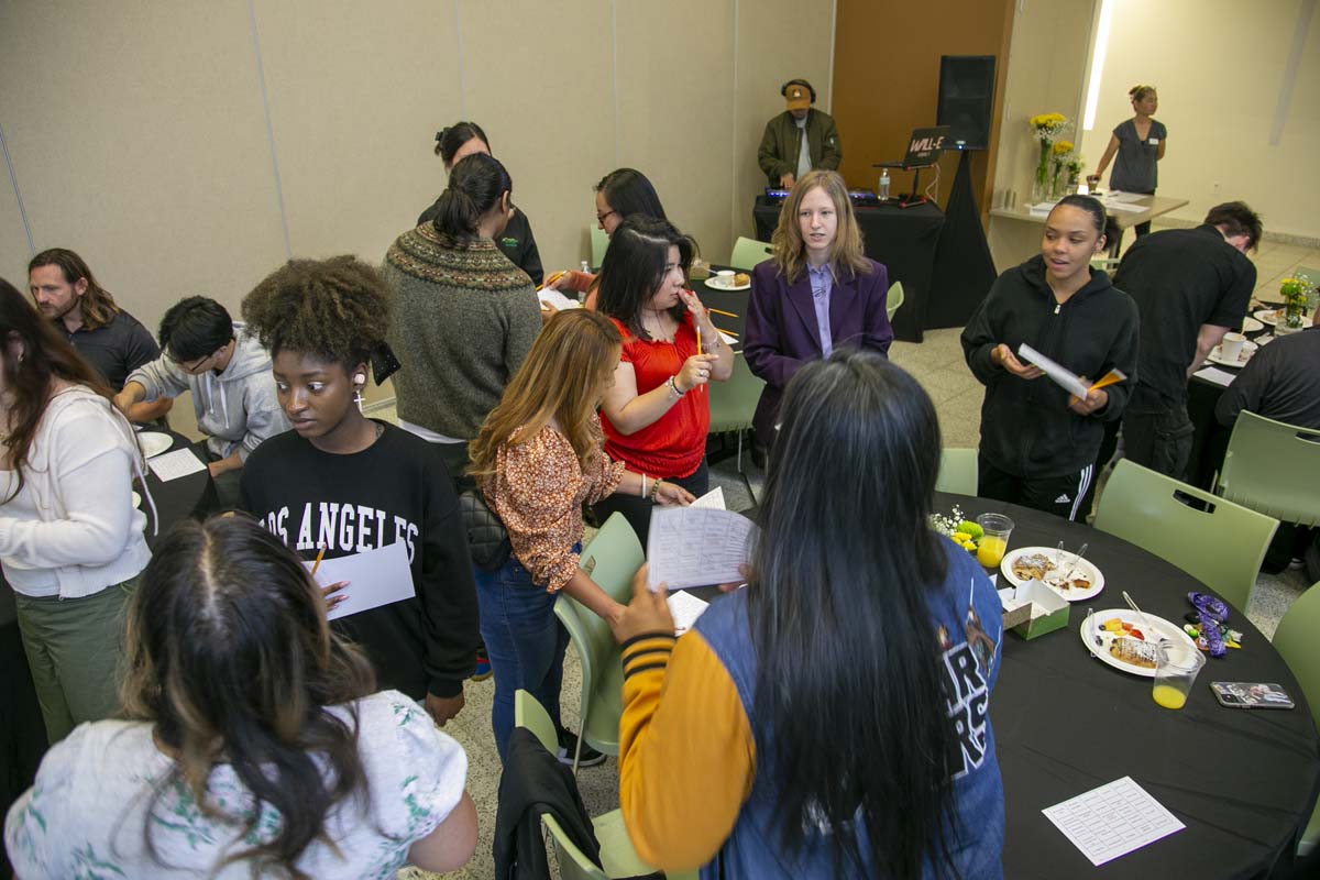 Students celebrate making deans list at event.