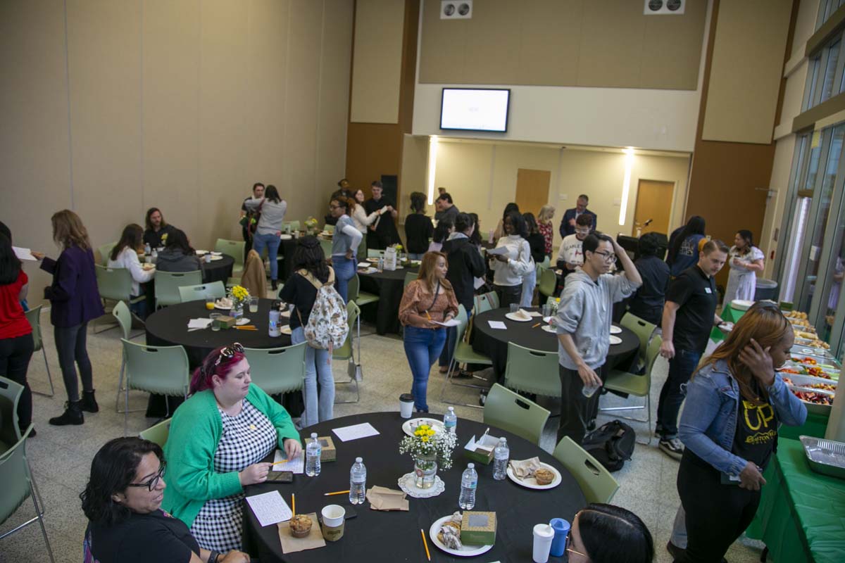 Students celebrate making deans list at event.