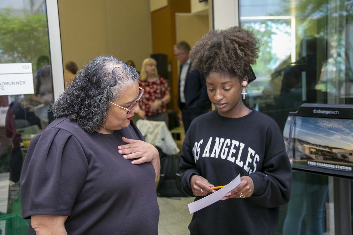 Students celebrate making deans list at event.