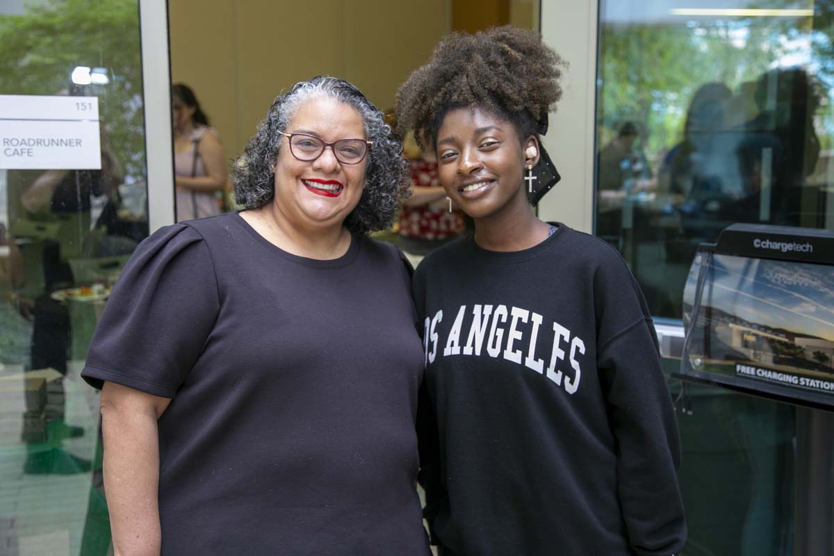 Students celebrate making deans list at event.