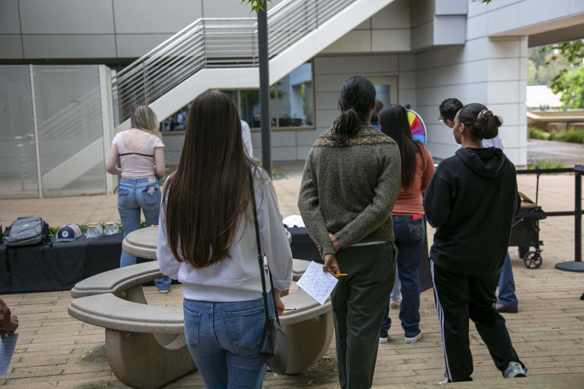 Students celebrate making deans list at event.