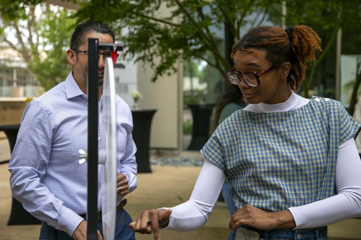 Students celebrate making deans list at event.