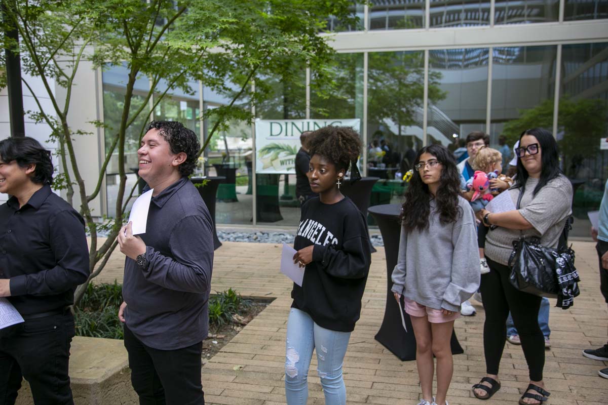 Students celebrate making deans list at event.