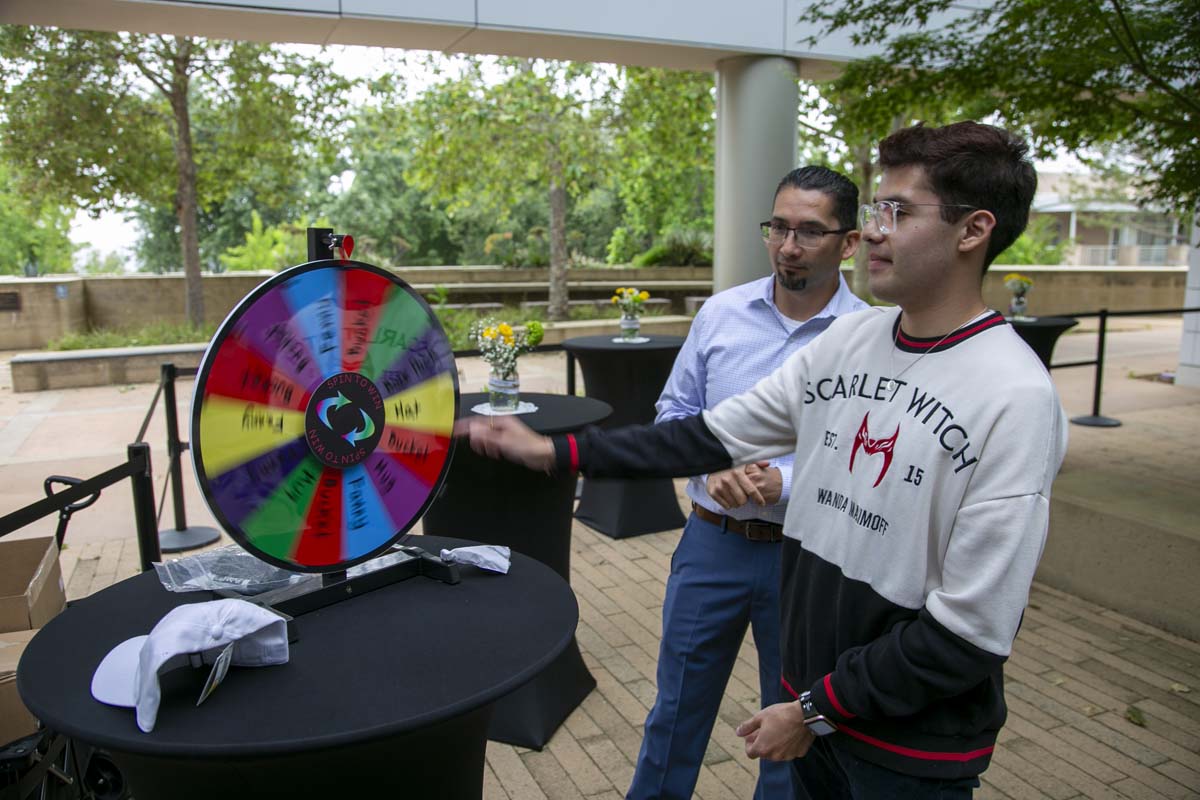 Students celebrate making deans list at event.