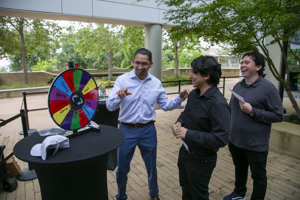 Students celebrate making deans list at event.