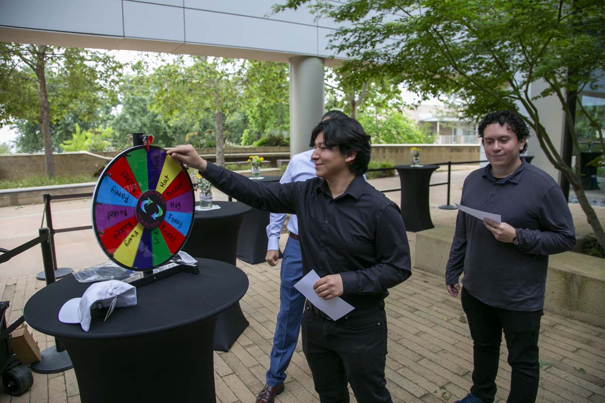 Students celebrate making deans list at event.