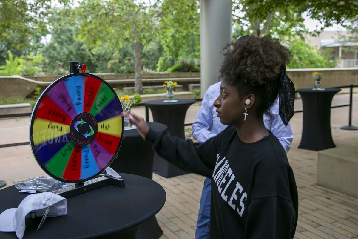 Students celebrate making deans list at event.