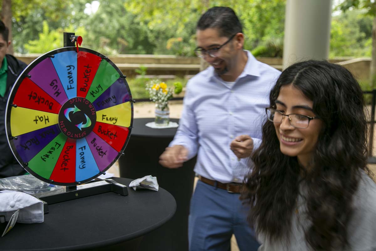 Students celebrate making deans list at event.