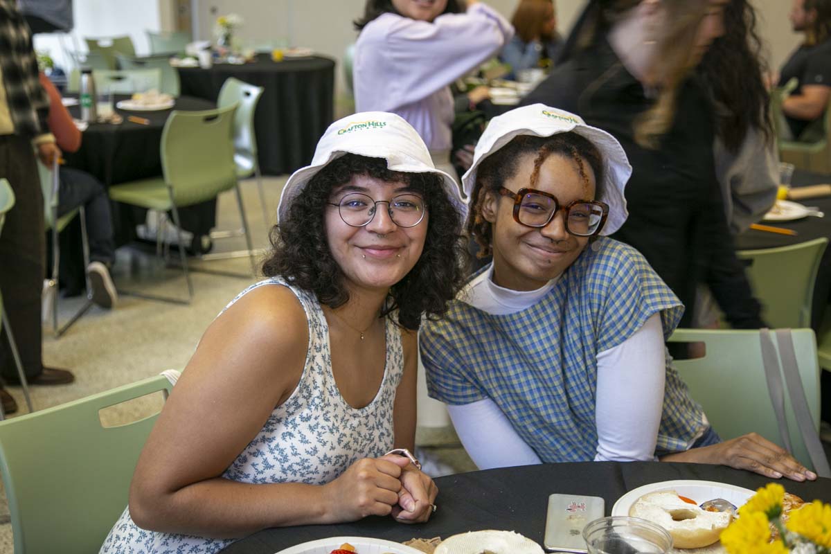 Students celebrate making deans list at event.