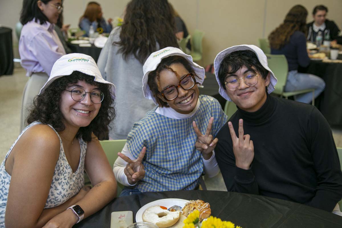 Students celebrate making deans list at event.