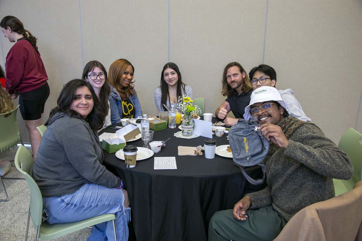 Students celebrate making deans list at event.