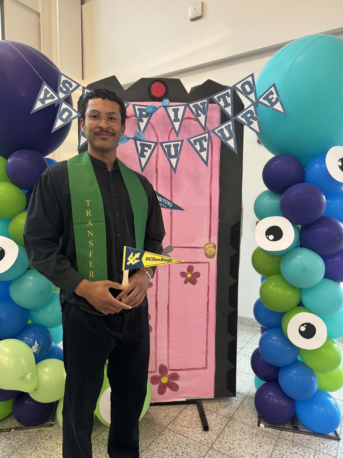 Students attend Transfer Dinner celebration with mascot Ryker.