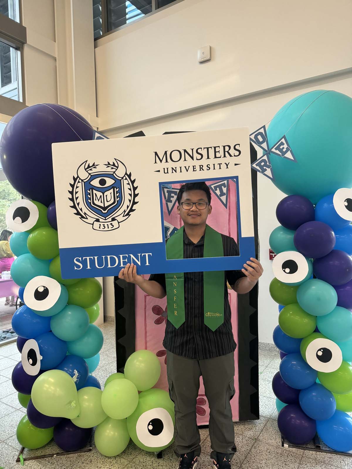 Students attend Transfer Dinner celebration with mascot Ryker.