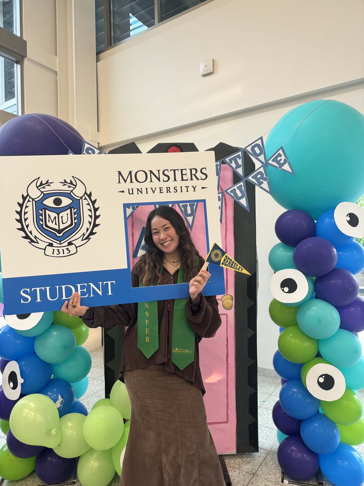 Students attend Transfer Dinner celebration with mascot Ryker.