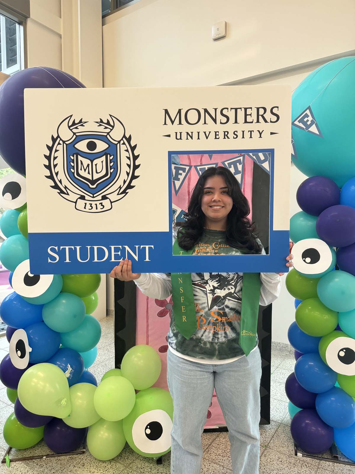 Students attend Transfer Dinner celebration with mascot Ryker.