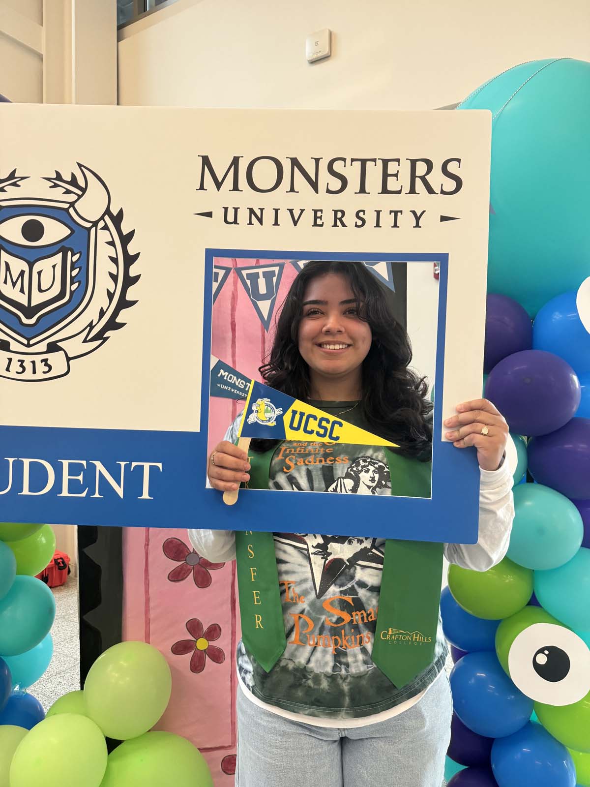 Students attend Transfer Dinner celebration with mascot Ryker.