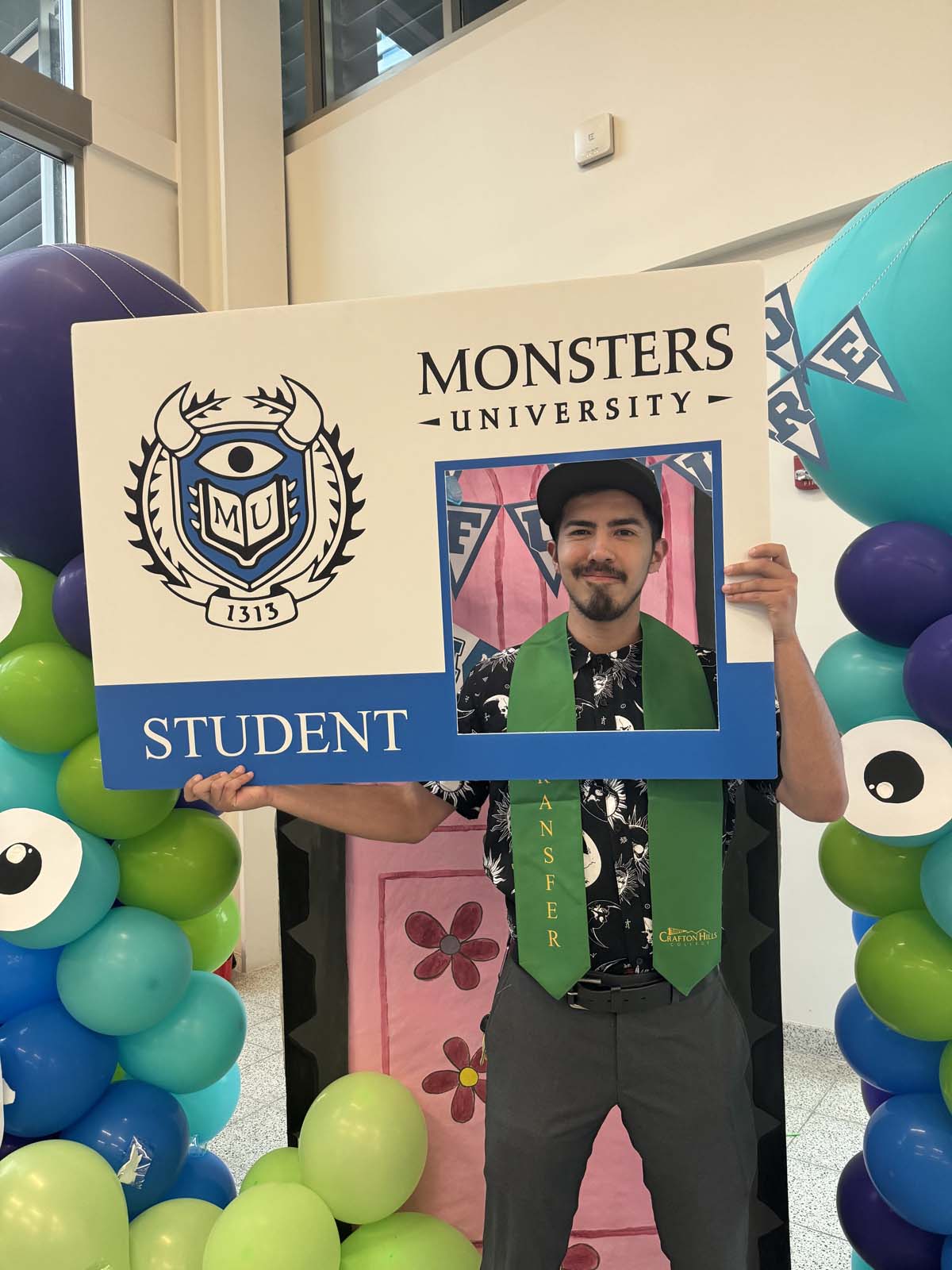 Students attend Transfer Dinner celebration with mascot Ryker.