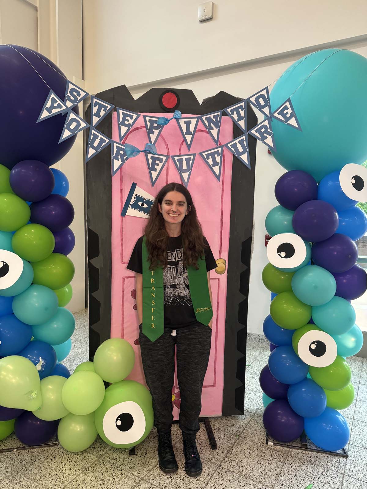 Students attend Transfer Dinner celebration with mascot Ryker.