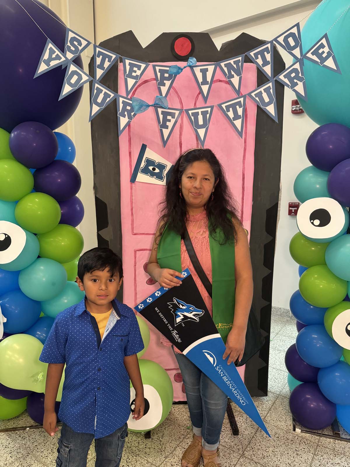 Students attend Transfer Dinner celebration with mascot Ryker.