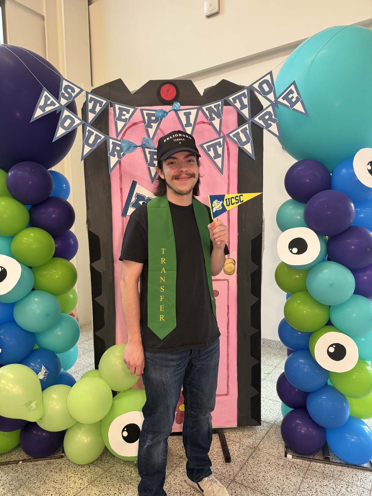 Students attend Transfer Dinner celebration with mascot Ryker.