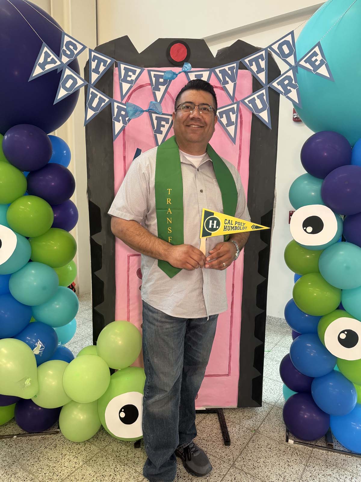 Students attend Transfer Dinner celebration with mascot Ryker.