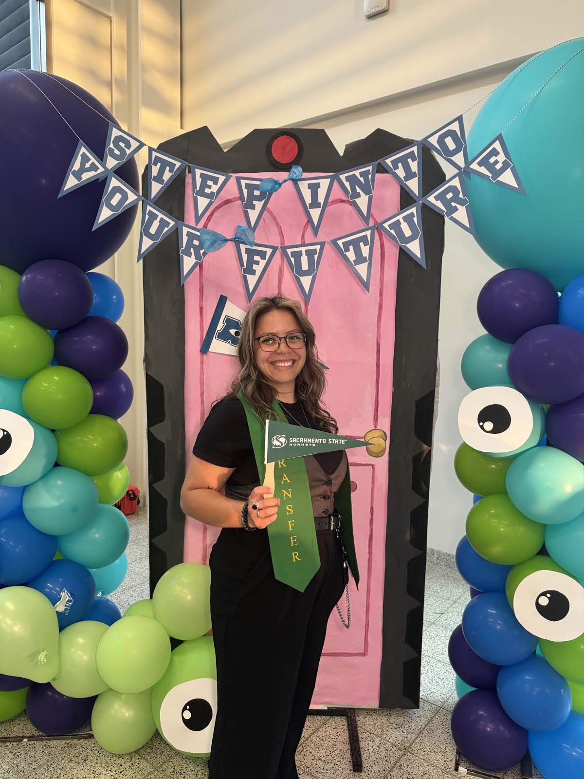 Students attend Transfer Dinner celebration with mascot Ryker.