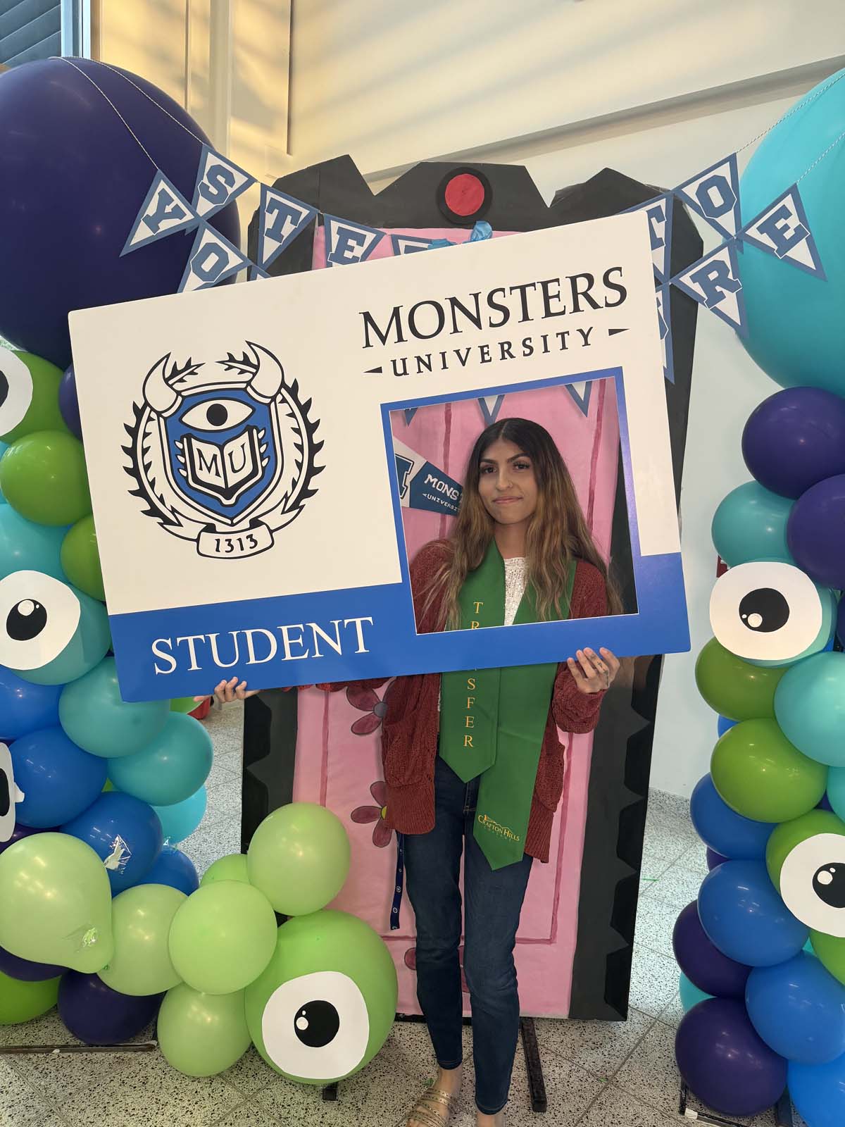 Students attend Transfer Dinner celebration with mascot Ryker.