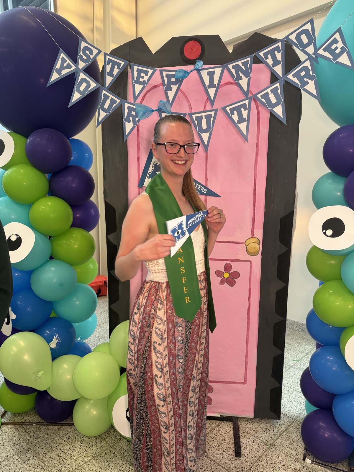 Students attend Transfer Dinner celebration with mascot Ryker.