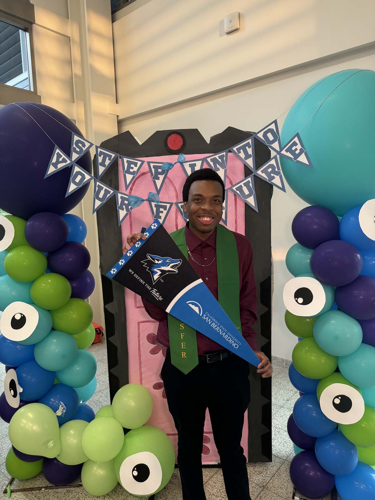 Students attend Transfer Dinner celebration with mascot Ryker.