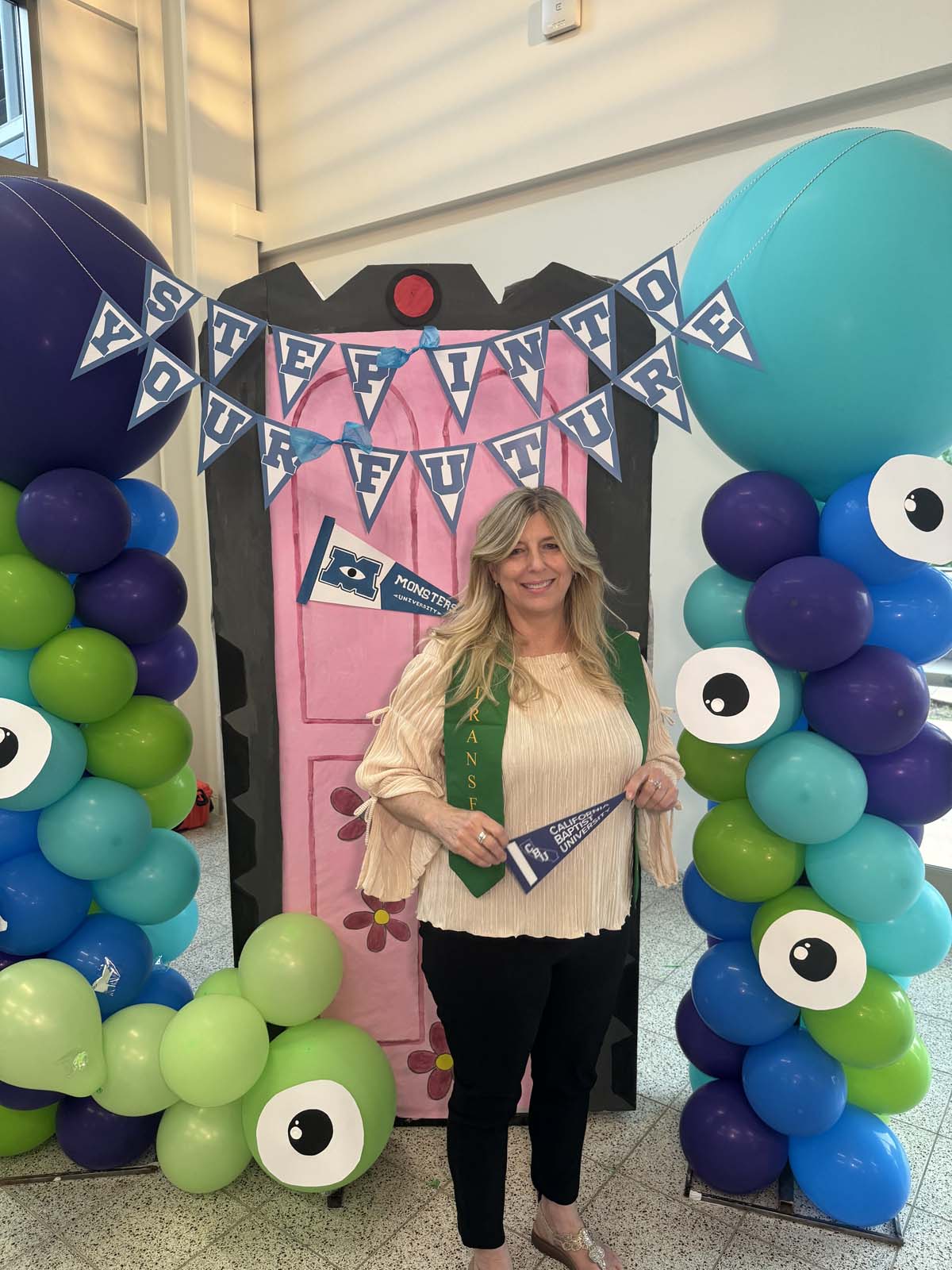 Students attend Transfer Dinner celebration with mascot Ryker.