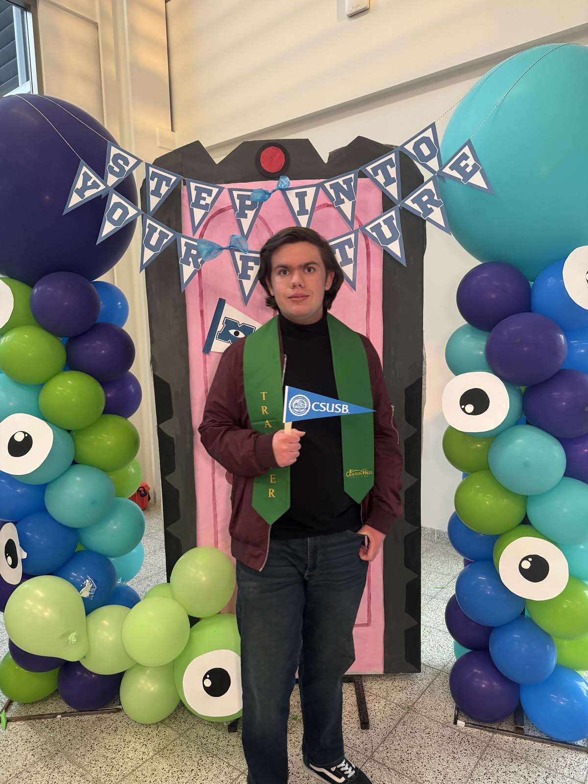 Students attend Transfer Dinner celebration with mascot Ryker.