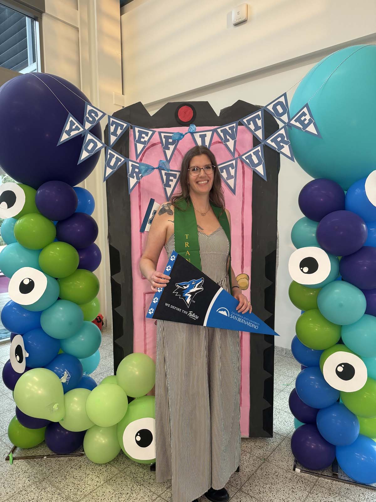 Students attend Transfer Dinner celebration with mascot Ryker.