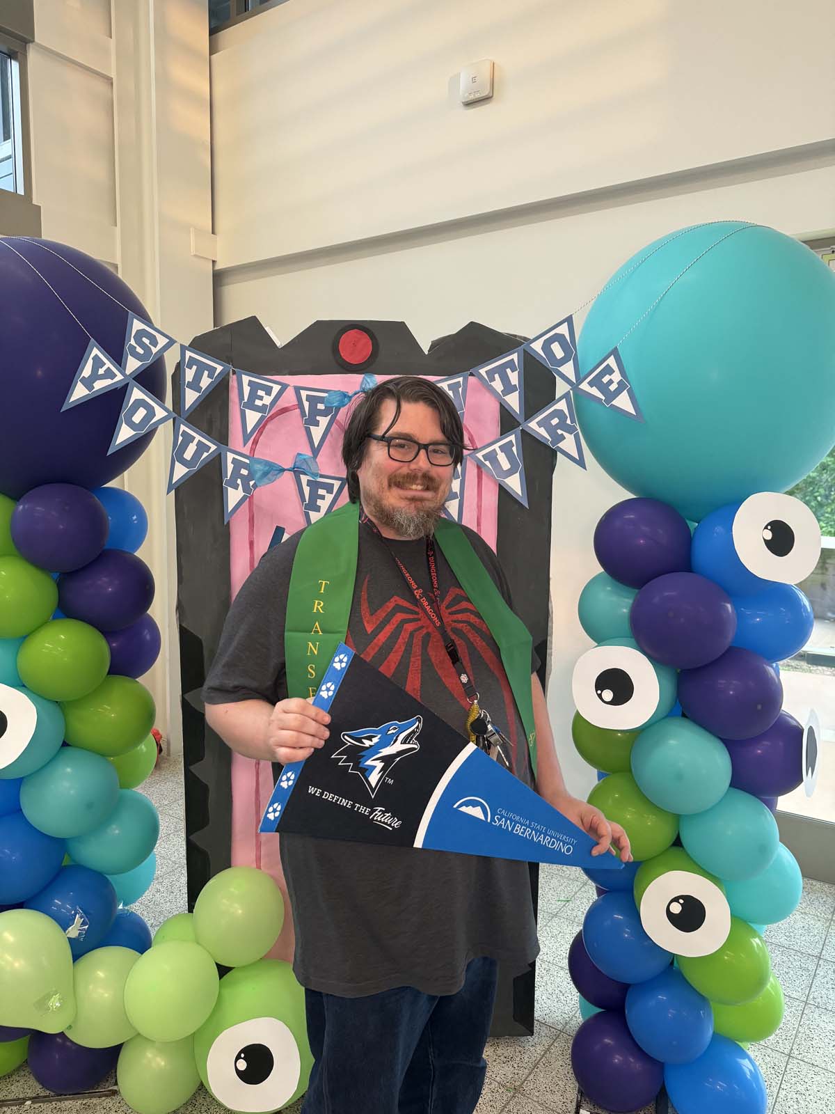 Students attend Transfer Dinner celebration with mascot Ryker.