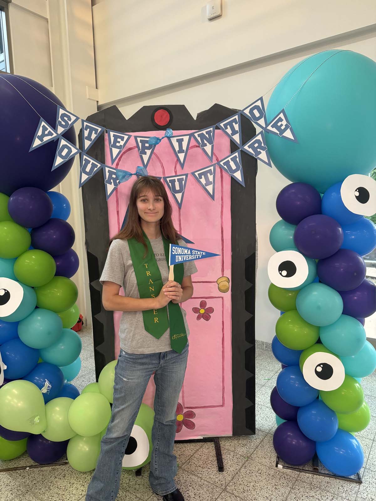 Students attend Transfer Dinner celebration with mascot Ryker.