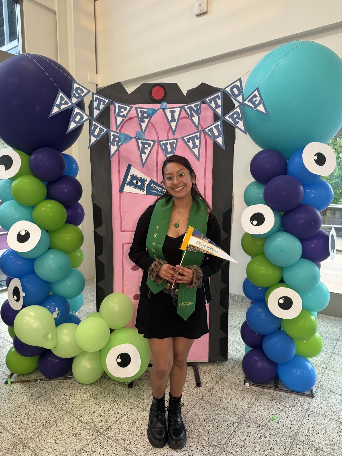 Students attend Transfer Dinner celebration with mascot Ryker.