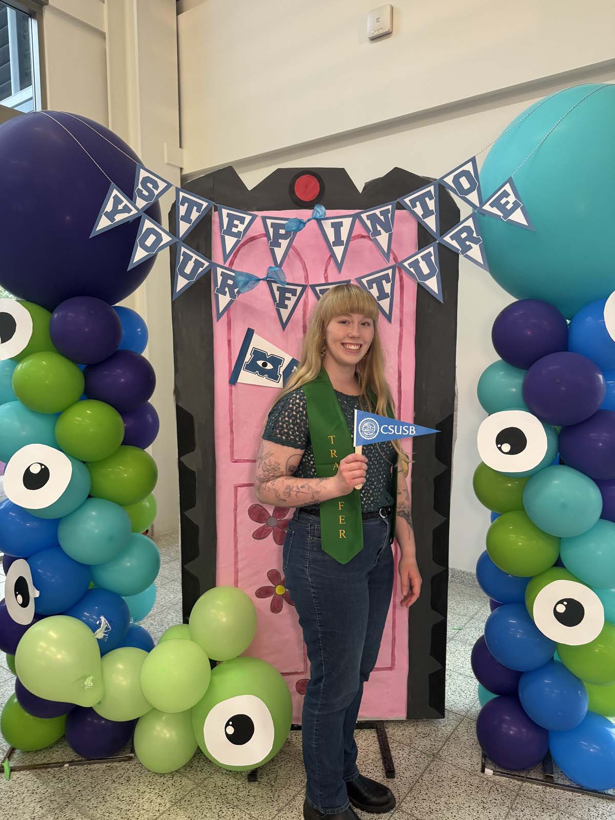 Students attend Transfer Dinner celebration with mascot Ryker.