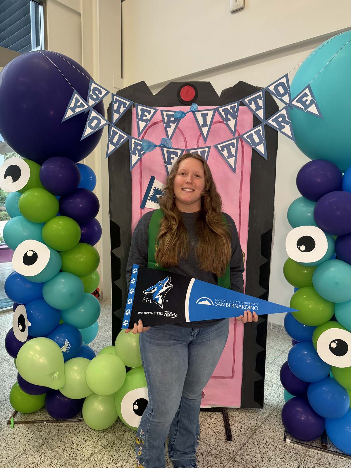Students attend Transfer Dinner celebration with mascot Ryker.