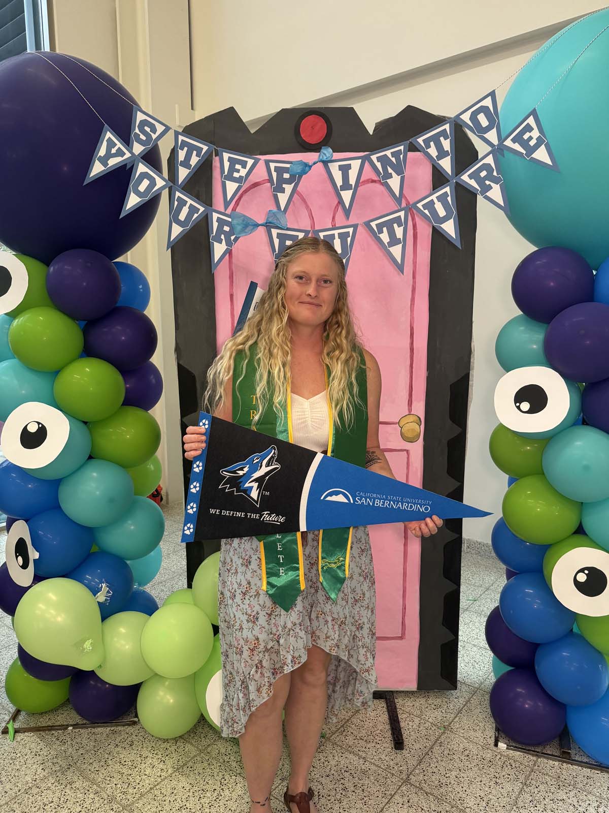 Students attend Transfer Dinner celebration with mascot Ryker.