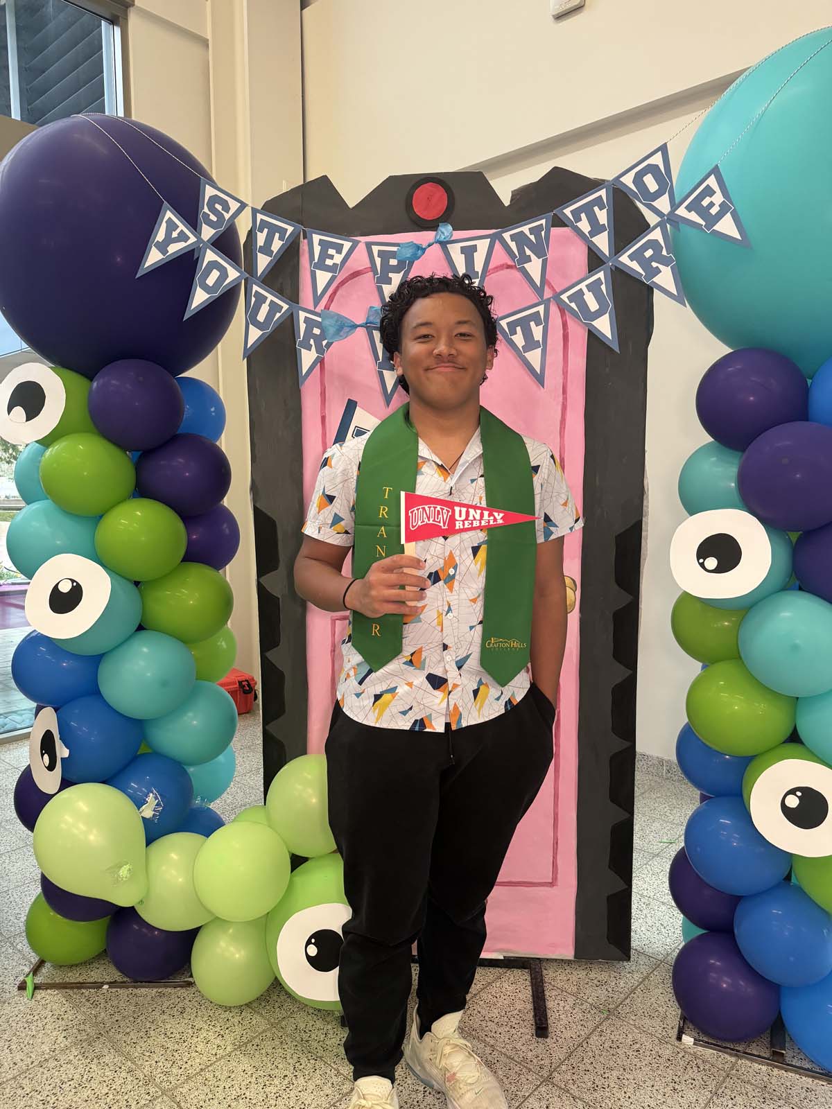 Students attend Transfer Dinner celebration with mascot Ryker.