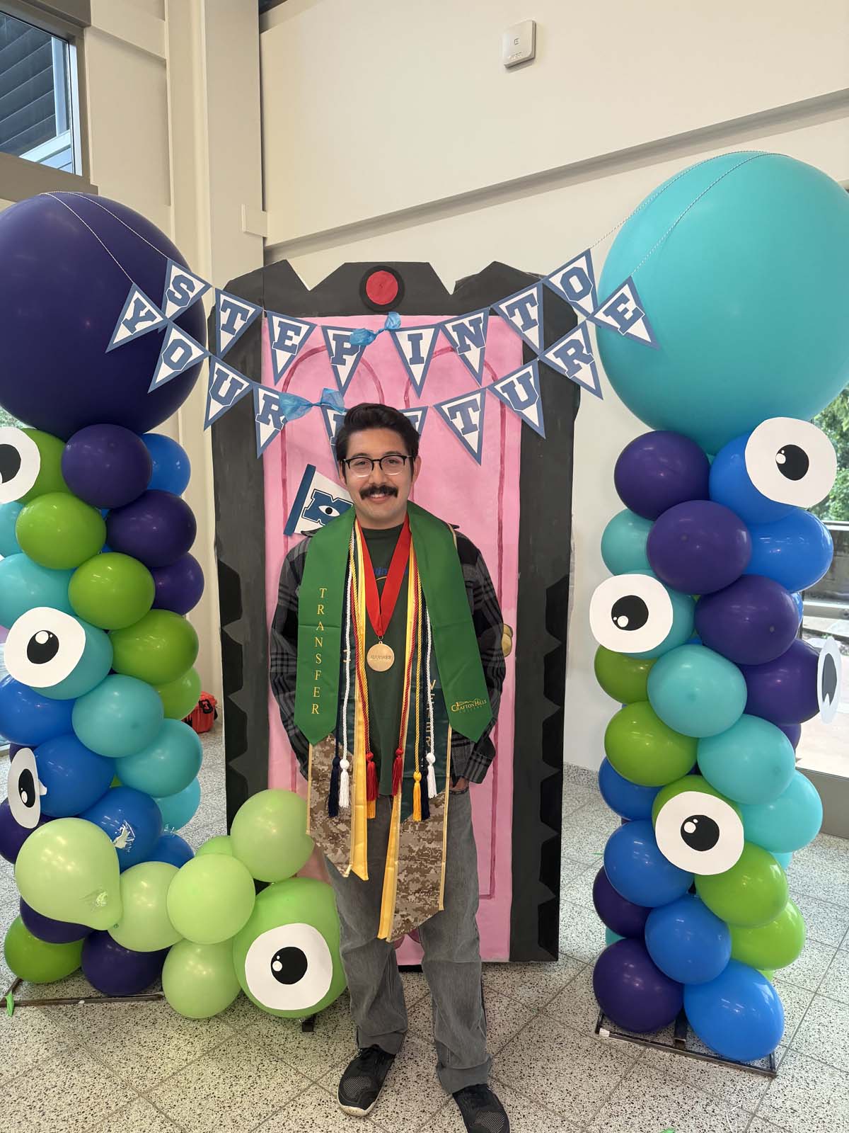 Students attend Transfer Dinner celebration with mascot Ryker.