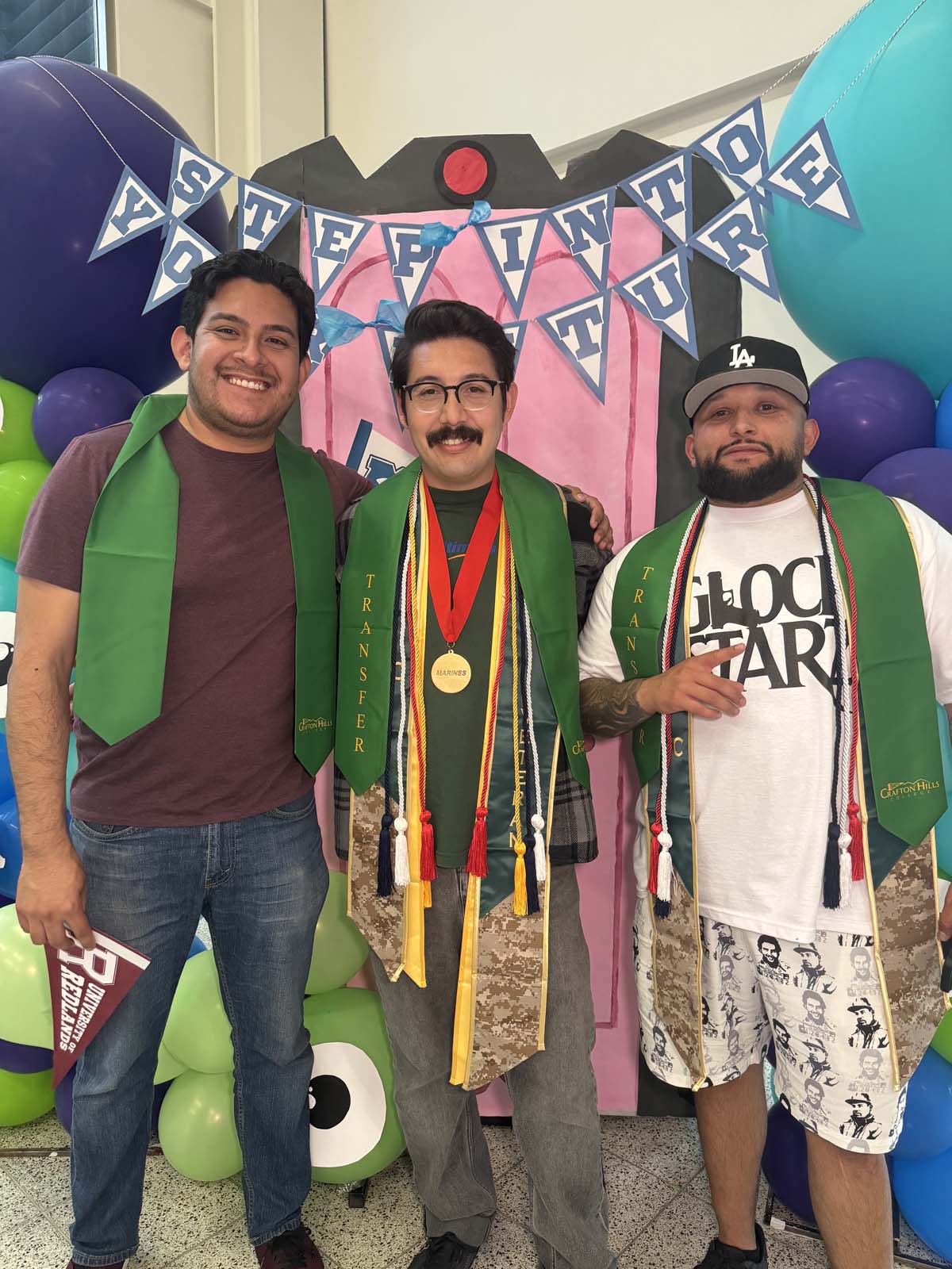 Students attend Transfer Dinner celebration with mascot Ryker.