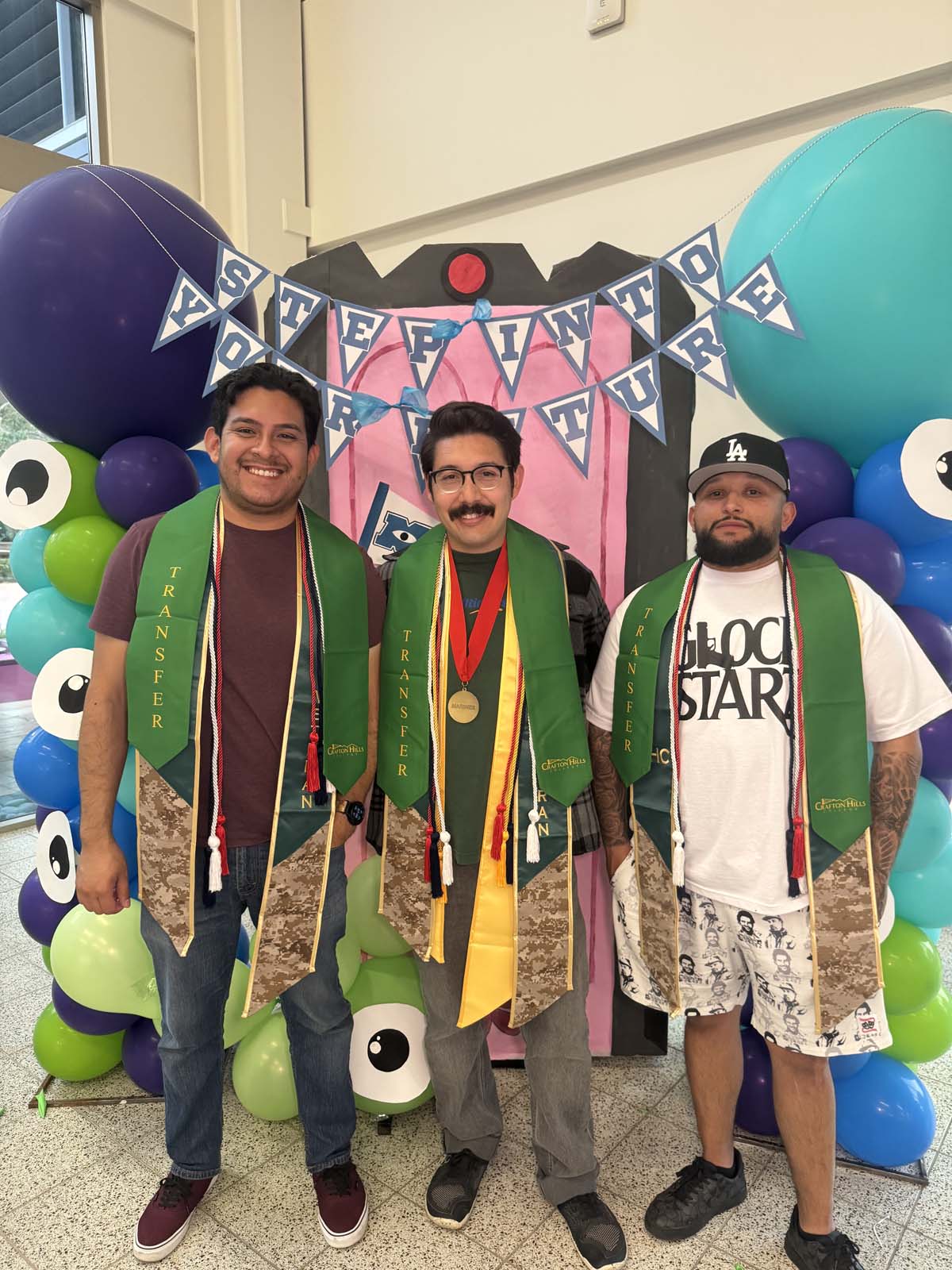 Students attend Transfer Dinner celebration with mascot Ryker.