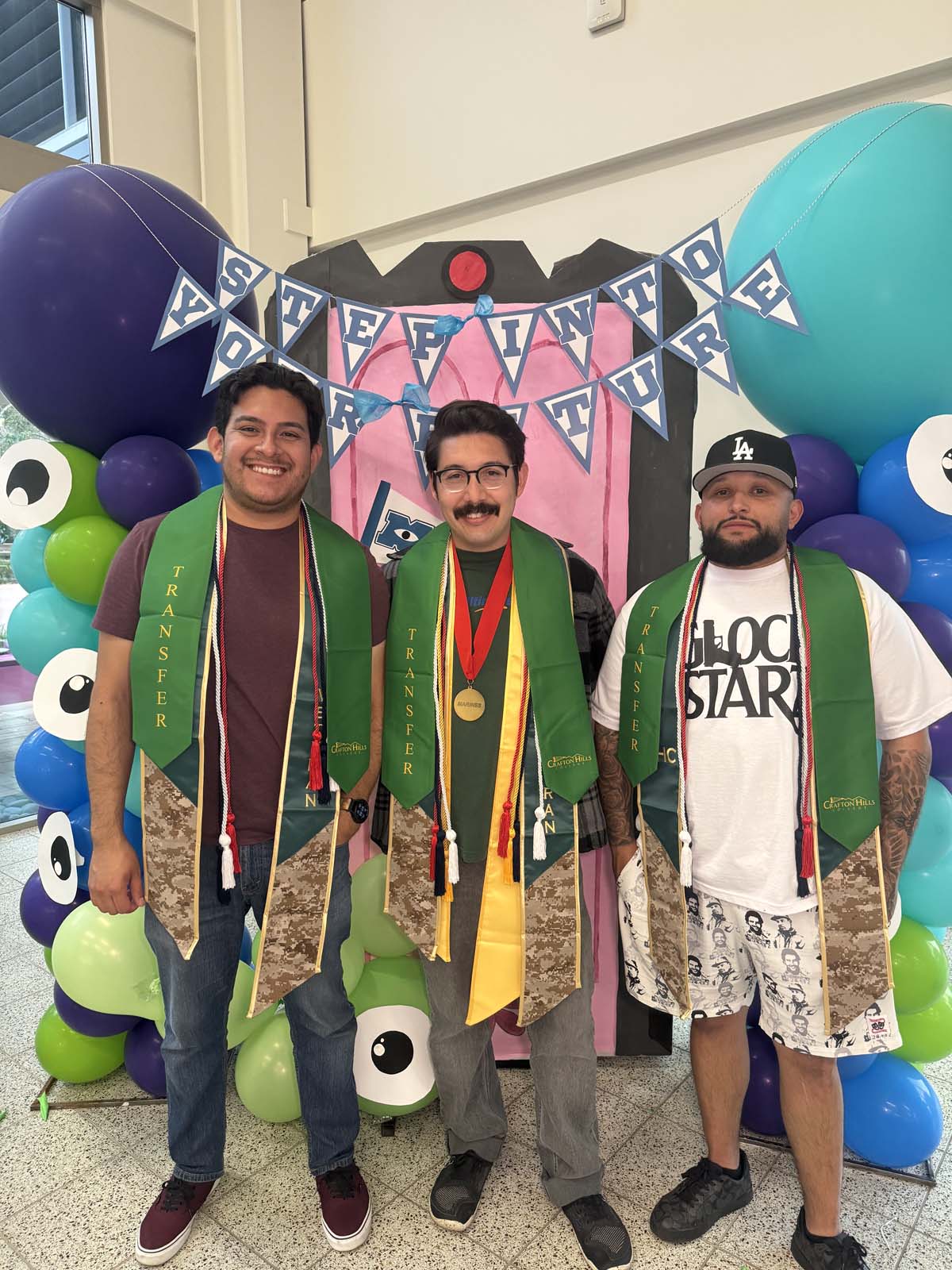 Students attend Transfer Dinner celebration with mascot Ryker.