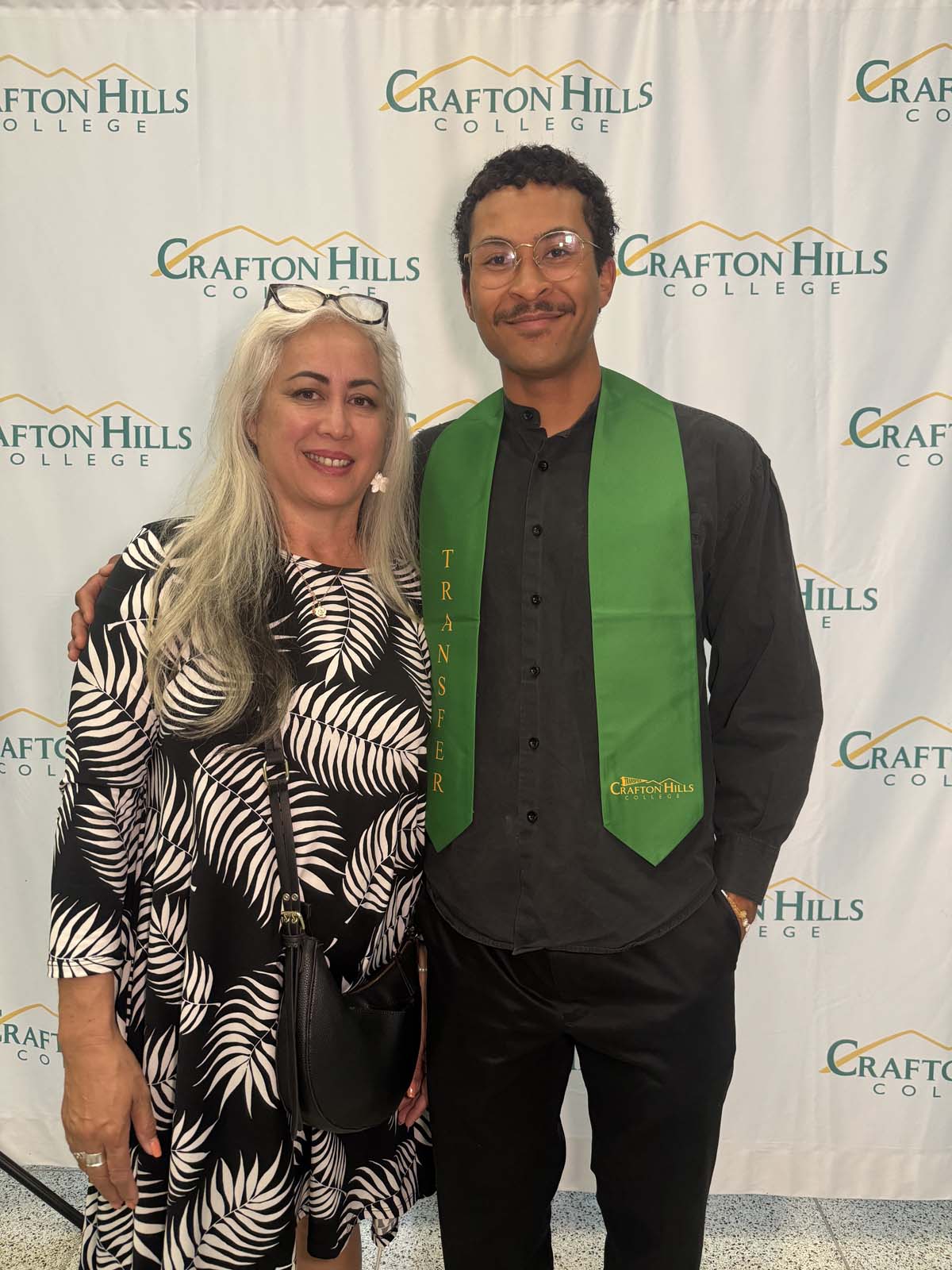 Students attend Transfer Dinner celebration with mascot Ryker.