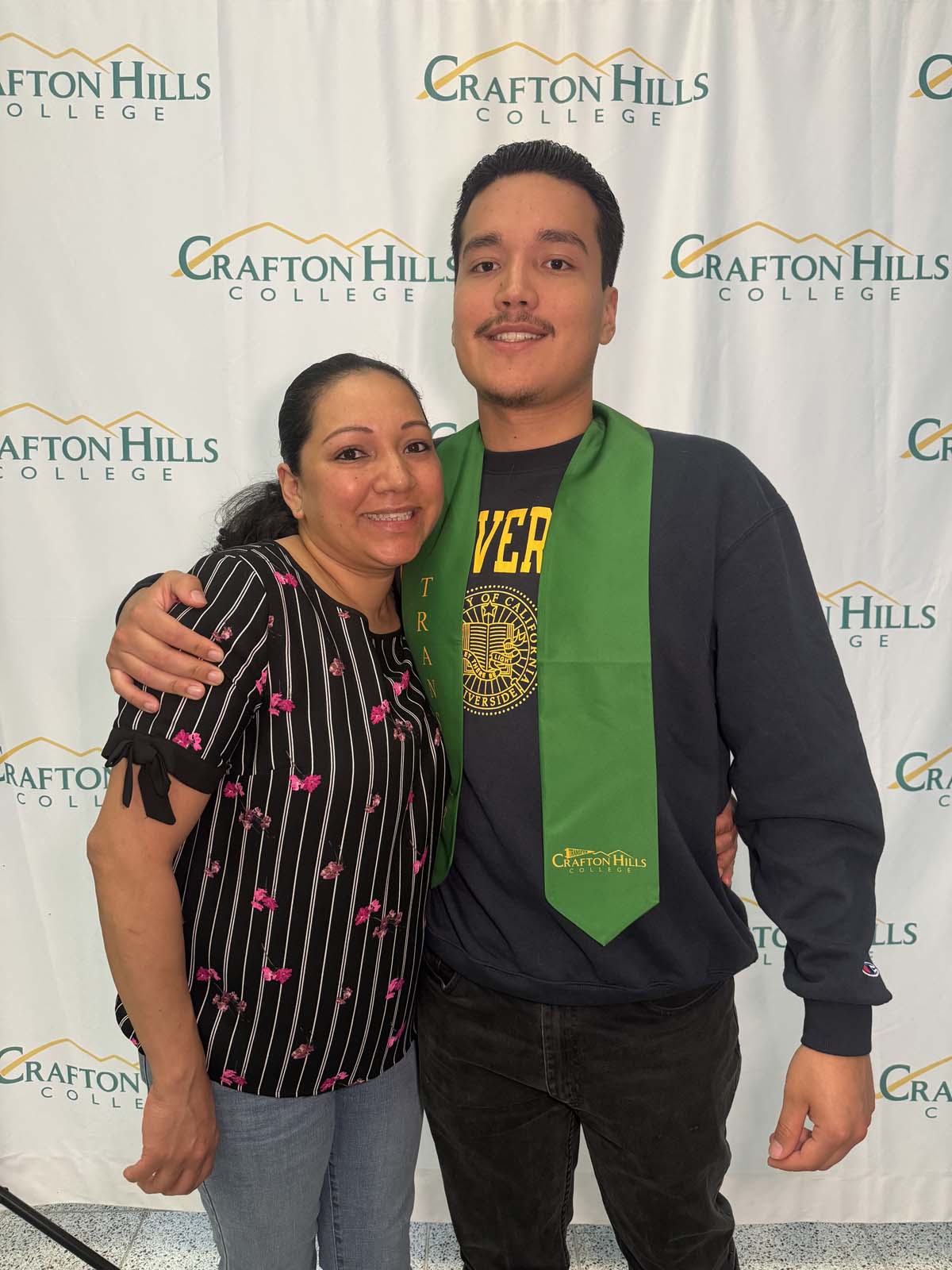 Students attend Transfer Dinner celebration with mascot Ryker.