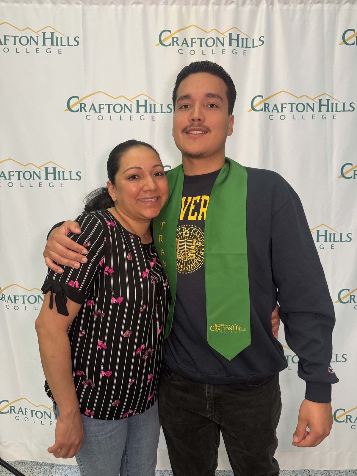 Students attend Transfer Dinner celebration with mascot Ryker.